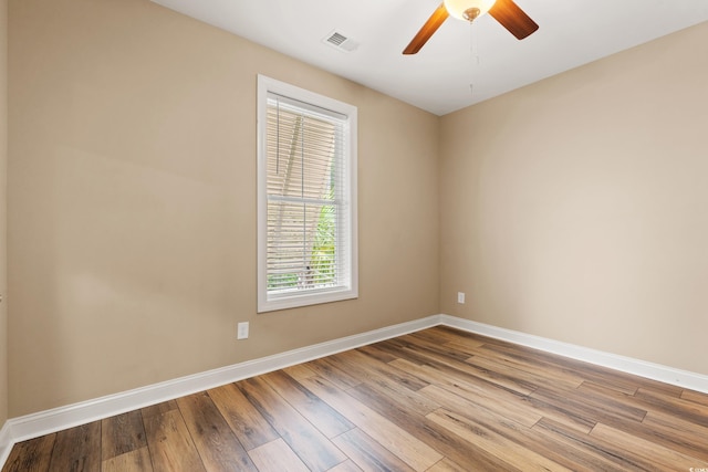 144 Puffin Dr Unit 2A, Pawleys Island, SC 29585 - empty room with baseboards, wood finished floors, and a ceiling fan