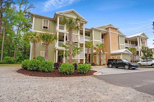 144 Puffin Dr Unit 2A, Pawleys Island, SC 29585 - view of building exterior with uncovered parking