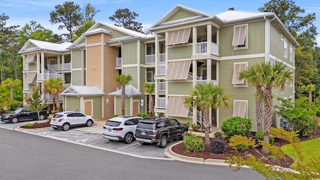 144 Puffin Dr Unit 2A, Pawleys Island, SC 29585 - view of building exterior featuring uncovered parking