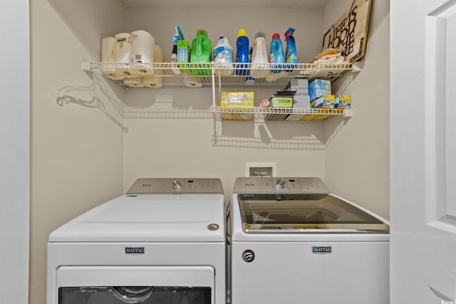 washroom with washing machine and dryer