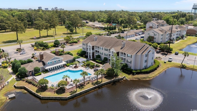 aerial view of a nearby body of water and a pool area