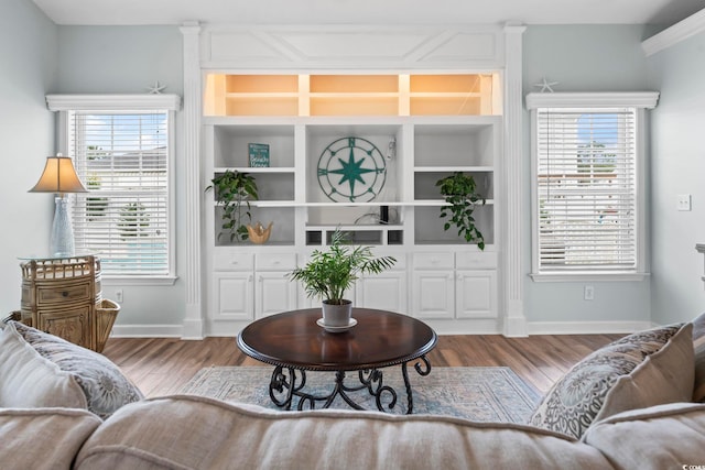living room with wood finished floors and baseboards