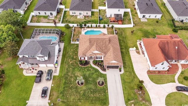 aerial view of residential area featuring a pool
