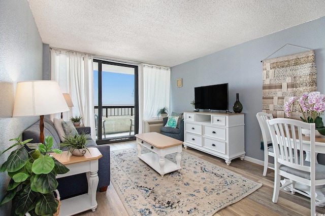 2311 S Ocean Blvd Unit 559, Myrtle Beach, SC 29577 - living area featuring a textured ceiling and wood finished floors