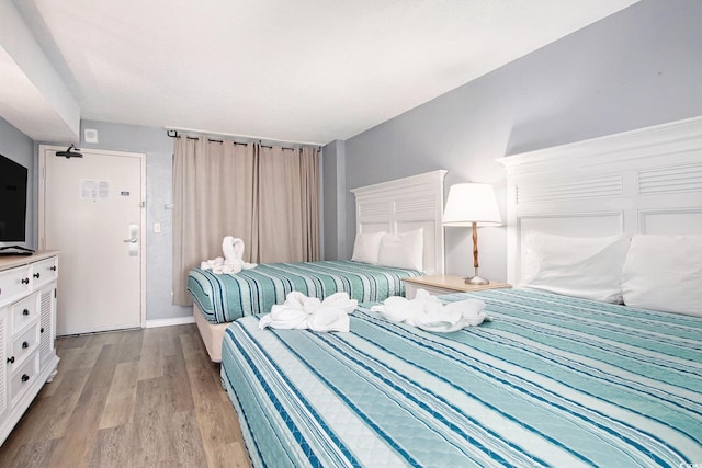 2311 S Ocean Blvd Unit 559, Myrtle Beach, SC 29577 - bedroom featuring light wood finished floors and baseboards