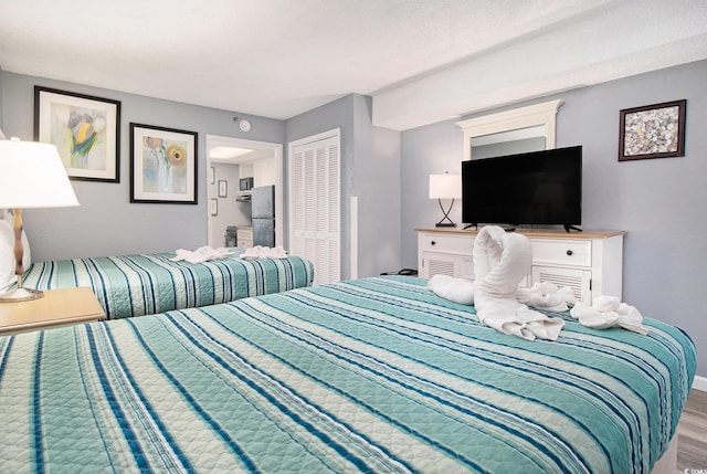 2311 S Ocean Blvd Unit 559, Myrtle Beach, SC 29577 - bedroom with wood finished floors, a closet, and baseboards