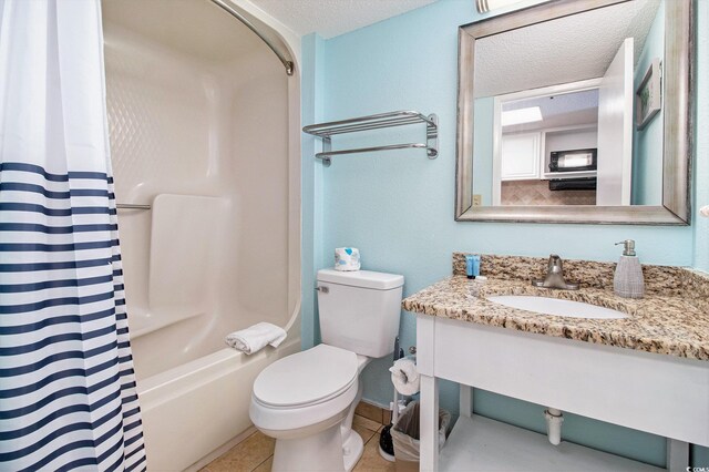 2401 S Ocean Blvd Unit 559, Myrtle Beach, SC 29577 - bathroom with a textured ceiling, vanity, toilet, shower / tub combo with curtain, and tile patterned flooring