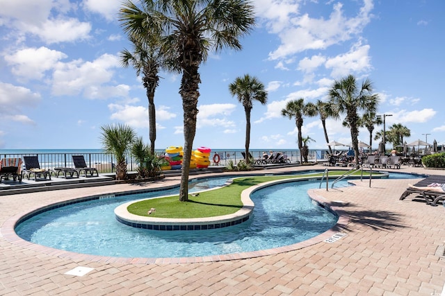 2311 S Ocean Blvd Unit 559, Myrtle Beach, SC 29577 - community pool featuring a patio and a water view