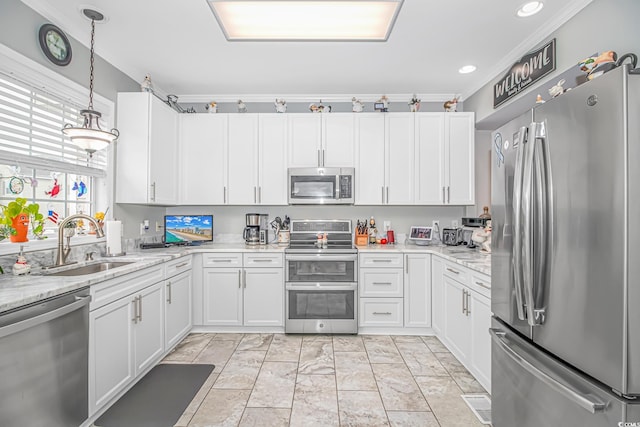 601 Hillside Dr N Unit 302, North Myrtle Beach, SC 29582 - kitchen featuring stainless steel appliances, a sink, white cabinetry, crown molding, and recessed lighting
