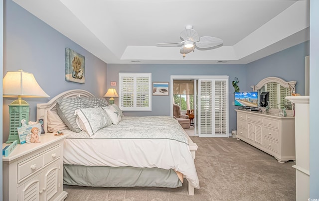 601 Hillside Dr N Unit 302, North Myrtle Beach, SC 29582 - bedroom with a tray ceiling, access to outside, carpet floors, and a ceiling fan