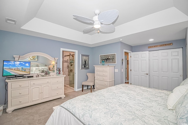 601 Hillside Dr N Unit 302, North Myrtle Beach, SC 29582 - bedroom with light colored carpet, a closet, ensuite bath, baseboards, and a raised ceiling