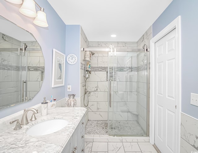 601 Hillside Dr N Unit 302, North Myrtle Beach, SC 29582 - bathroom featuring marble finish flooring, a stall shower, vanity, and recessed lighting