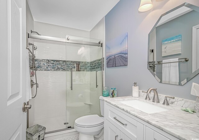 601 Hillside Dr N Unit 302, North Myrtle Beach, SC 29582 - bathroom with toilet, a shower stall, and vanity