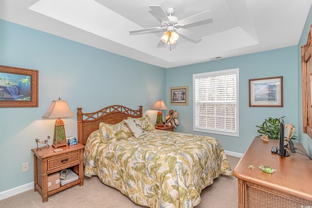 601 Hillside Dr N Unit 302, North Myrtle Beach, SC 29582 - carpeted bedroom featuring a tray ceiling, baseboards, and ceiling fan