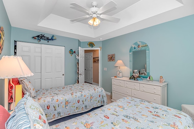 601 Hillside Dr N Unit 302, North Myrtle Beach, SC 29582 - bedroom with a tray ceiling, a closet, and a ceiling fan