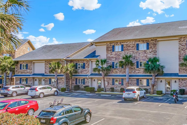 207 Double Eagle Dr Unit F-3, Myrtle Beach, SC 29575 - view of building exterior with uncovered parking