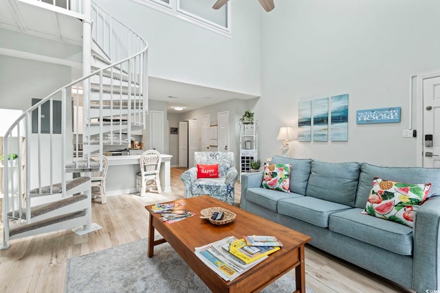 207 Double Eagle Dr Unit F-3, Myrtle Beach, SC 29575 - living room featuring stairs, wood finished floors, a ceiling fan, and a high ceiling