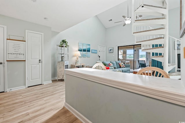207 Double Eagle Dr Unit F-3, Myrtle Beach, SC 29575 - kitchen with light wood-type flooring, ceiling fan, high vaulted ceiling, and open floor plan