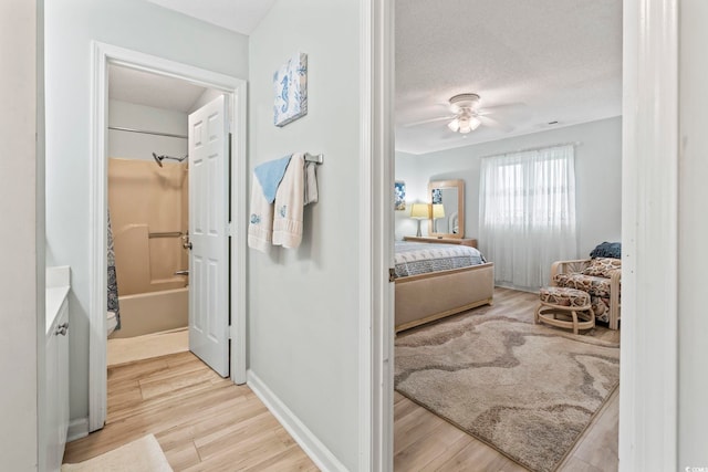 207 Double Eagle Dr Unit F-3, Myrtle Beach, SC 29575 - bedroom with wood finished floors, a textured ceiling, and ceiling fan