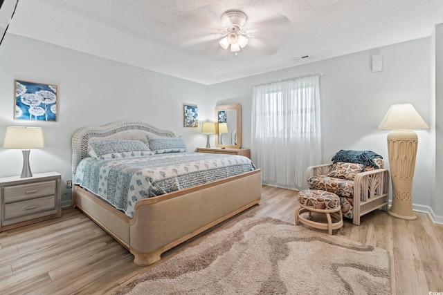 207 Double Eagle Dr Unit F-3, Myrtle Beach, SC 29575 - bedroom with wood finished floors, a textured ceiling, and ceiling fan