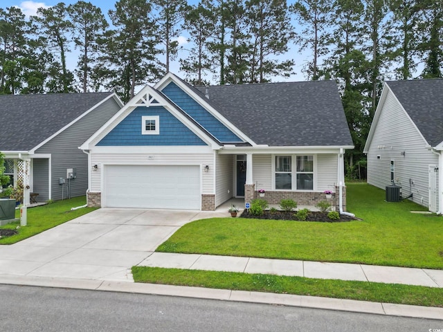 2405 Capri Ct, Conway, SC 29527 - craftsman-style home with brick siding, a front lawn, driveway, a garage, and central AC unit