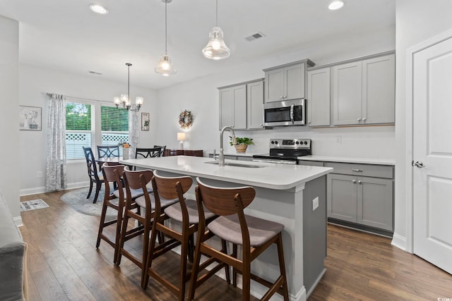 2405 Capri Ct, Conway, SC 29527 - kitchen with gray cabinets, stainless steel appliances, a sink, a kitchen island with sink, and recessed lighting