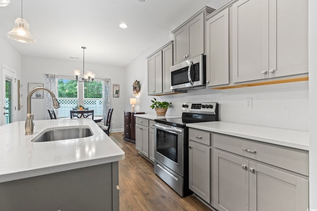 2405 Capri Ct, Conway, SC 29527 - kitchen featuring appliances with stainless steel finishes, a sink, gray cabinets, dark wood-type flooring, and recessed lighting
