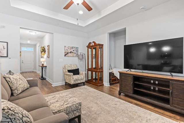 2405 Capri Ct, Conway, SC 29527 - living room featuring wood finished floors, a ceiling fan, baseboards, a tray ceiling, and recessed lighting