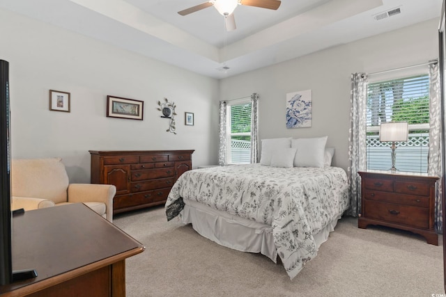 2405 Capri Ct, Conway, SC 29527 - bedroom featuring light colored carpet, a ceiling fan, and a raised ceiling