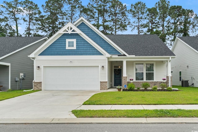 2405 Capri Ct, Conway, SC 29527 - craftsman-style house with brick siding, an attached garage, a front yard, and driveway