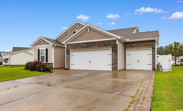 2317 Myerlee Dr, Myrtle Beach, SC 29588 - craftsman-style house with stone siding, a garage, concrete driveway, and a shingled roof