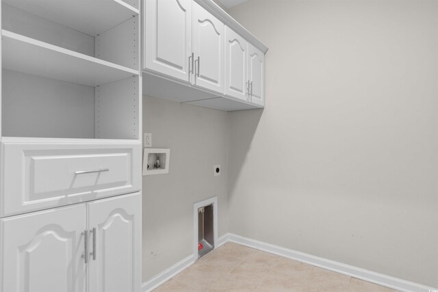 2317 Myerlee Dr, Myrtle Beach, SC 29588 - washroom featuring hookup for a washing machine, baseboards, hookup for an electric dryer, cabinet space, and light tile patterned floors