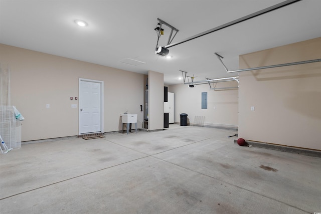 2317 Myerlee Dr, Myrtle Beach, SC 29588 - garage featuring electric panel, a sink, and a garage door opener