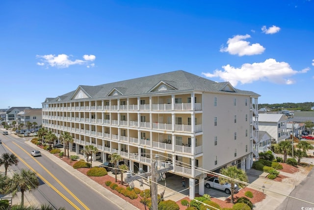 view of apartment building / complex featuring an attached garage