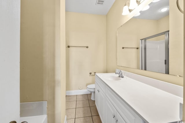 full bath featuring tile patterned flooring, a shower stall, toilet, vanity, and baseboards