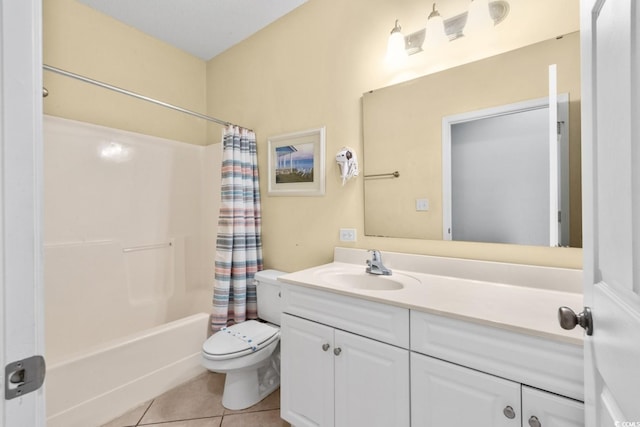 full bath with vanity, tile patterned floors, toilet, and shower / tub combo