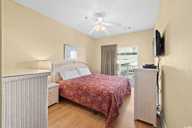 bedroom featuring light wood-style flooring and ceiling fan