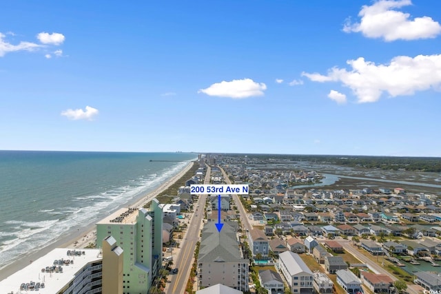 aerial view of waterfront with a beach