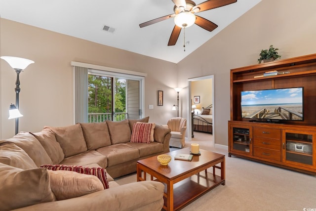 living area featuring light carpet, a ceiling fan, and high vaulted ceiling