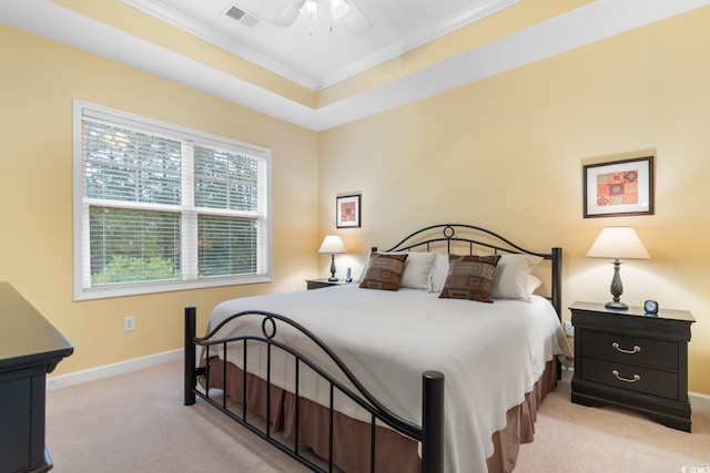 carpeted bedroom featuring ornamental molding, baseboards, and ceiling fan