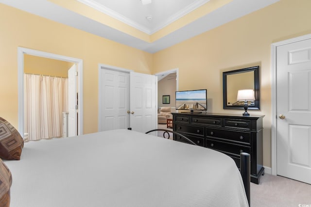 bedroom with crown molding, carpet, and a closet