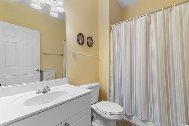 bathroom with toilet, vanity, a shower with curtain, and tile patterned flooring