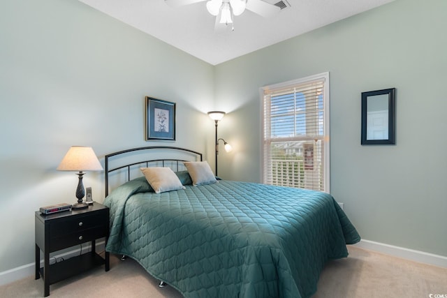 carpeted bedroom featuring baseboards