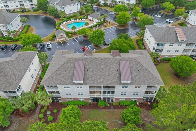 aerial view of property and surrounding area featuring a pool