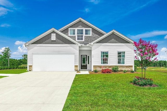 240 Wagner Cir, Conway, SC 29526 - craftsman house with stone siding, driveway, a front yard, board and batten siding, and a garage