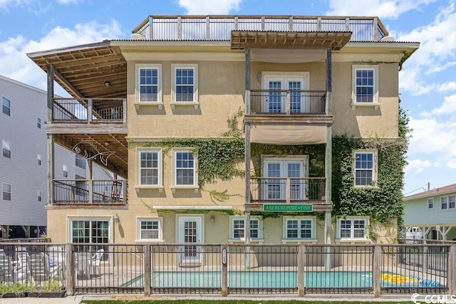 view of property featuring fence