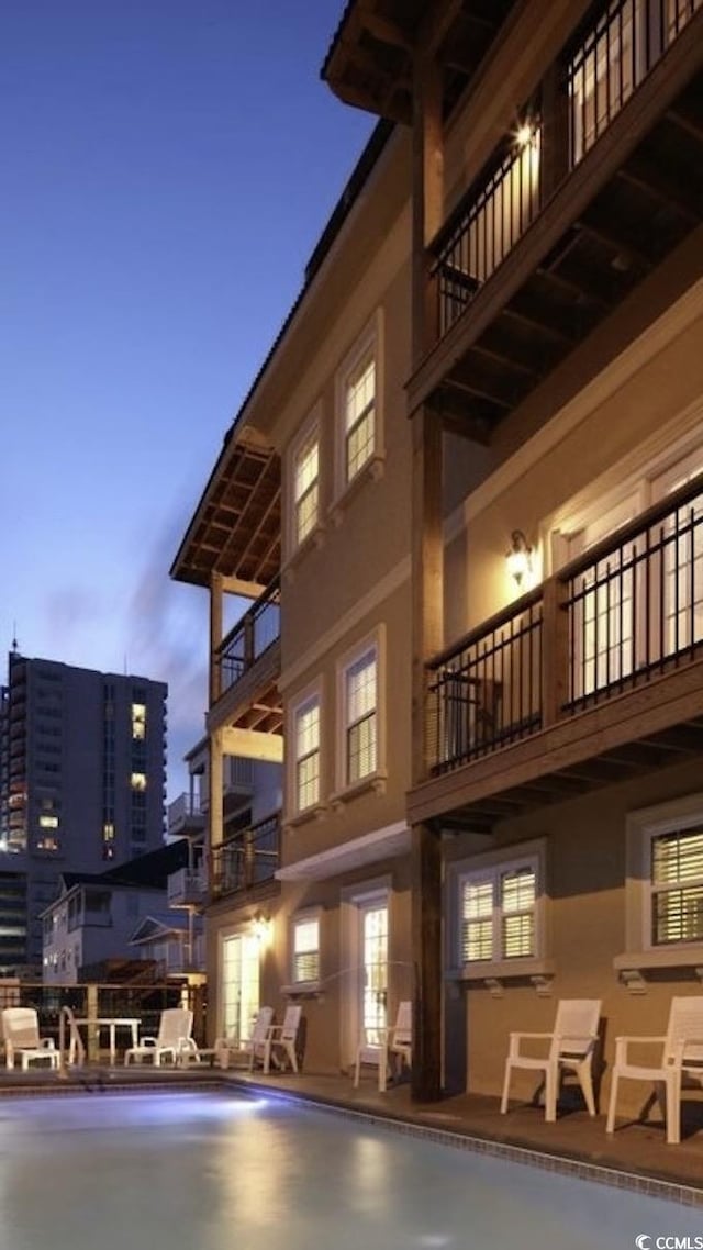 view of building exterior with a community pool