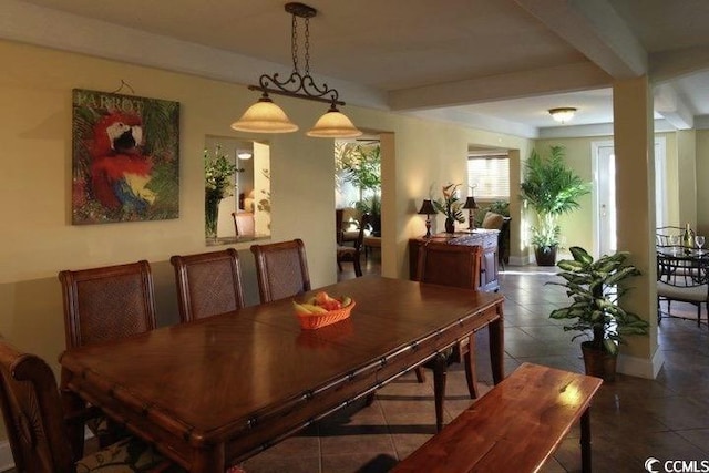 tiled dining room with beam ceiling