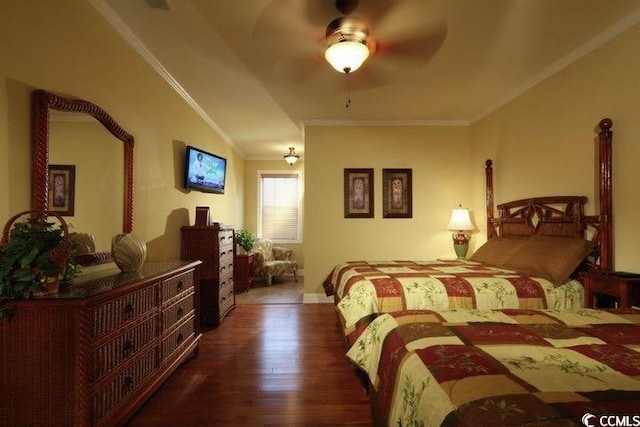bedroom featuring crown molding, wood finished floors, and ceiling fan