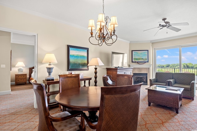 8121 Amalfi Pl Unit 7-604, Myrtle Beach, SC 29572 - carpeted dining space with ornamental molding, a fireplace, baseboards, a chandelier, and a ceiling fan